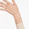 Swarovski női karkötő – arany tónusú bevonat, fehér kristályokkal