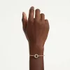 Swarovski Dextera női karkötő fehér kristályokkal és arany bevonattal